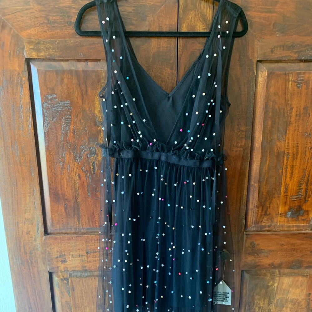 Beaded dress with black slip